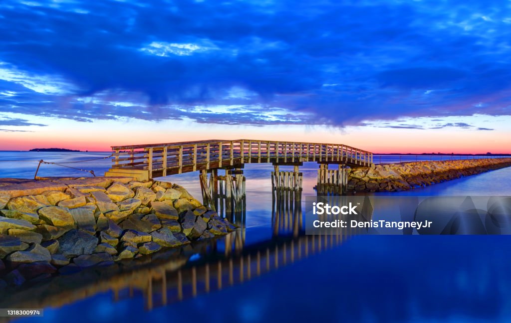 Plymouth harbor jetty bridge Plymouth is located approximately 40 miles south of Boston, Massachusetts in a region known as the South Shore. Plymouth  holds a place of great prominence in American history, folklore, and culture, and is known as "America's Hometown." Massachusetts Stock Photo