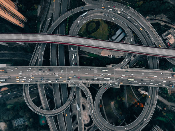 istock Aerial View of Complex Overpass and Busy Traffic 1318302929