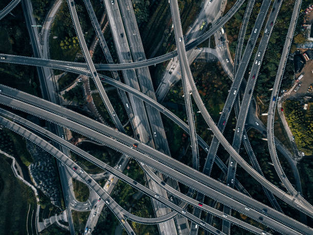 istock Aerial View of Complex Overpass and Busy Traffic 1318302931