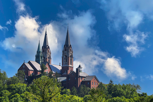 View at the bell towers and part of the church of the Catholic Maria Laach Abbey near Glees in Germany. The abbey dates back to the year1100 and is now a monastery of the Benedictine Confederation.