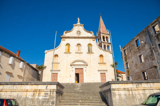 Historic church in Milna on Brac island, Dalmatia, Croatia Milna, Croatia - April 1, 2021: Historic church in Milna on Brac island, Dalmatia, Croatia old catholic church on island brac croatia stock pictures, royalty-free photos & images