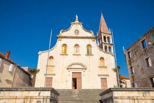Historic church in Milna on Brac island, Dalmatia, Croatia Milna, Croatia - April 1, 2021: Historic church in Milna on Brac island, Dalmatia, Croatia old catholic church on island brac croatia stock pictures, royalty-free photos & images