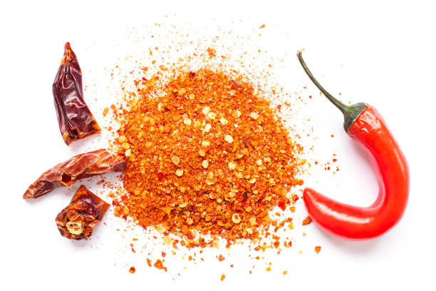 istock Chili, red pepper flakes and chili powder burst 1318305207