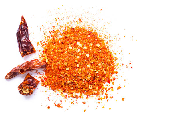 istock Chili, red pepper flakes and chili powder burst 1318305220
