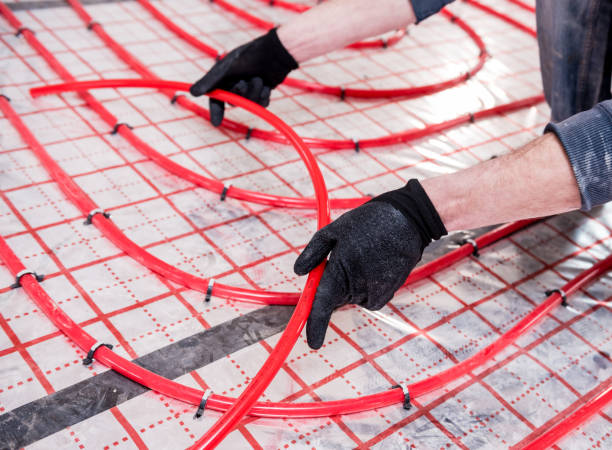 istock Pipefitter install system of underfloor heating system at home 1318310617