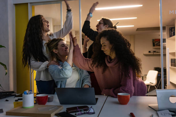 istock New business startup: all women team work together in coworking office 1318312983