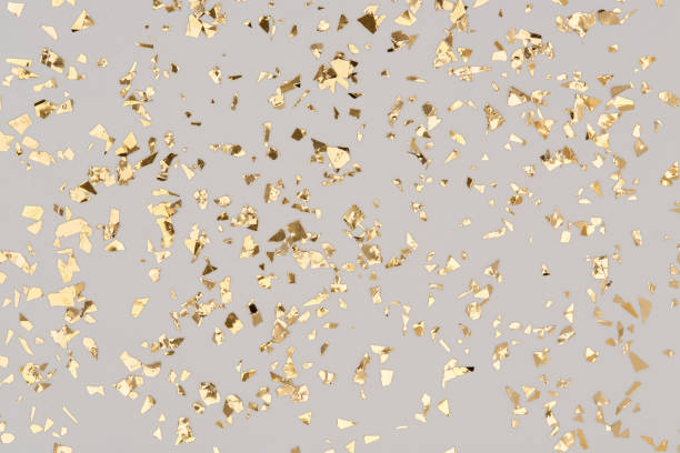 istock Golden confetti on grey background, party gold foil glitter backdrop. 1318314017