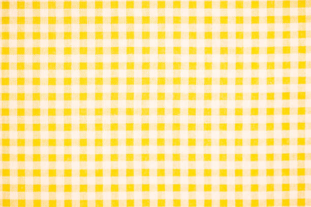Gingham pattern in yellow and white, closed up texture of yellow and white for background. Picnic table cloth. stock photo