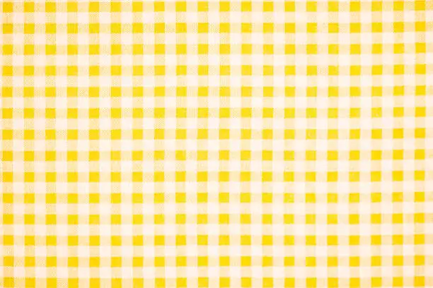 Photo of Gingham pattern in yellow and white, closed up texture of yellow and white for background. Picnic table cloth.