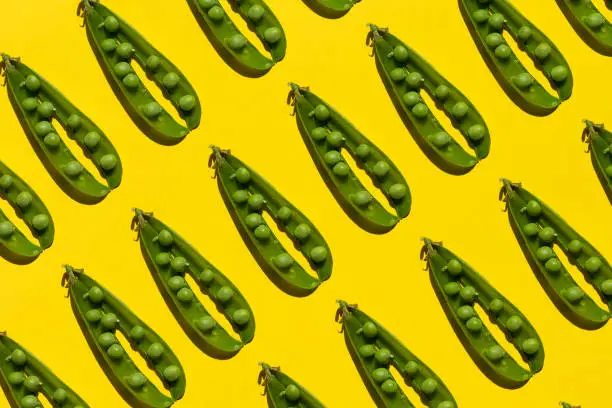 Green pea pattern on yellow background
