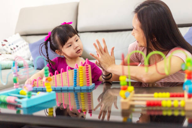 istock mother high five to daughter during homeschooling 1318321451