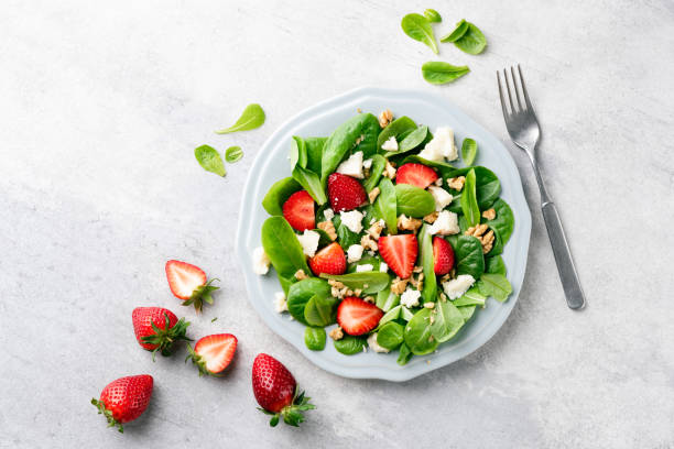 istock Healthy summer salad with strawberries and white cheese 1318322748