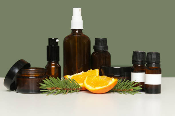istock Various brown glass cosmetics bottles on green background 1318323409