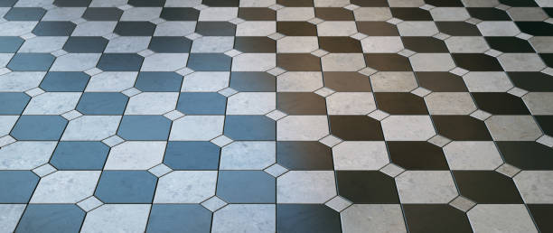 Shiny black and white square mosaic floor in a checked pattern - low angle diminishing perspective