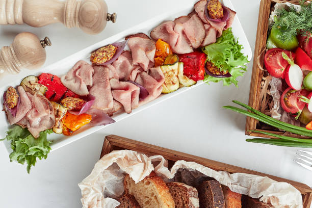 Beautifully decorated catering banquet table with different food snacks and appetizers
