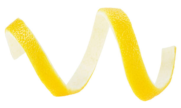 istock Lemon zest isolated on a white background. Ripe lemon twist. Cocktail ingredient. 1318326344