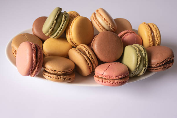 istock Sweet macaroons cookies on white background. Horizontal. 1318330926