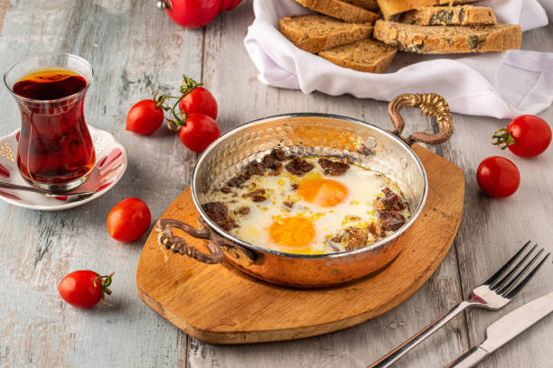 istock Turkish scrambled eggs with roasted meat in copper pan 1318331327