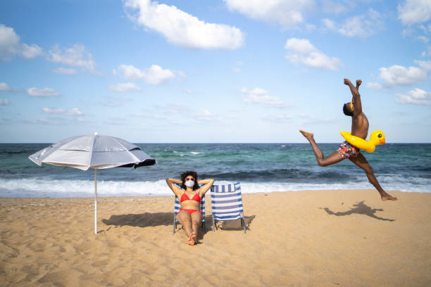 Single mother and young son enjoy time at the beach