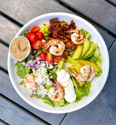 High angle view of a cobb salad with grilled shrimp