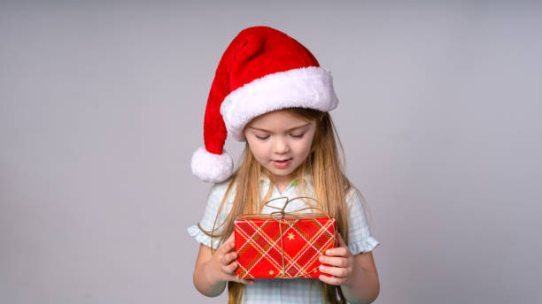 istock Girl 4-5 years is enjoying a Christmas present 1318340562