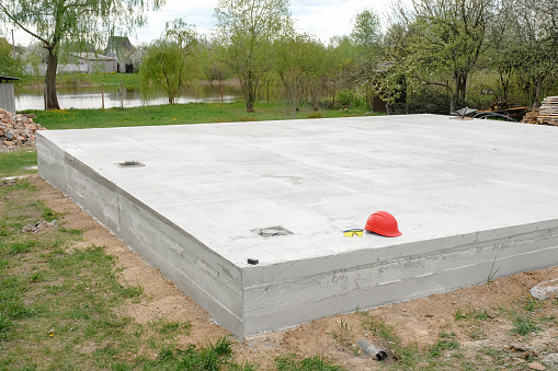 Cement foundation of a new house on a construction site. Laying a concrete foundation.