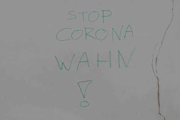 istock Text on Wall Stop Corona Madness german 