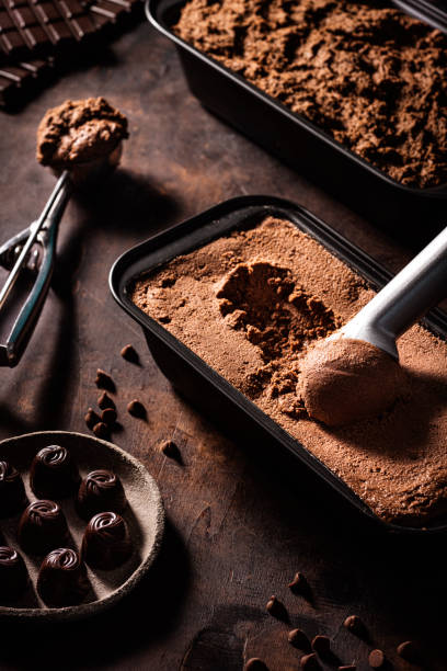 istock Chocolate ice cream scoop ball serving and chocolates macro close-up 1318351507
