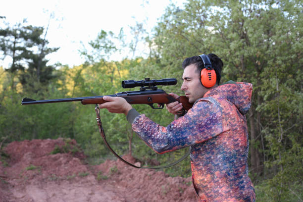 istock Man holding gun stock photo 1318355682