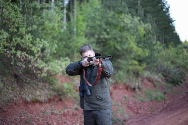 istock Man holding gun stock photo 1318357007