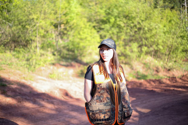 istock Woman hunter, looking for birds stock photo 1318358321