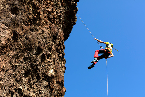 Epic Adventurous Extreme Sport Composite of Rock Climbing Man Rappelling