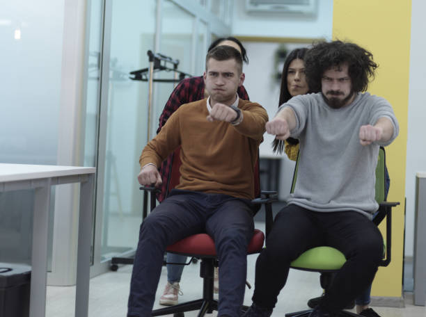 istock Multiethnic startup group at office chair race 1318360531