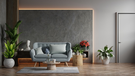 Living room loft in industrial style with blue sofa on empty concrete wall background,3d rendering