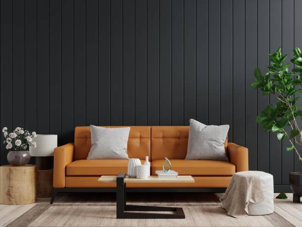 istock Mockup wall in dark living room interior background with Leather sofa and table on empty dark wooden wall background. 1318368568