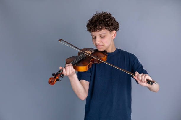 Teenage boy playing violin