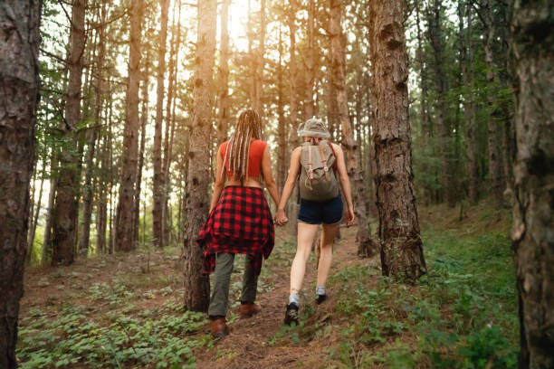 istock Unrecognizable lesbian couple exploring nature 1318372535