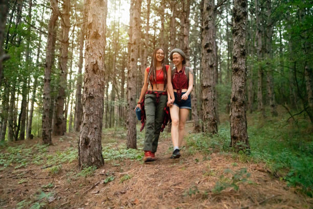 istock Cheerful lesbian couple exploring nature together 1318372546