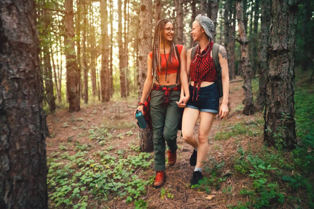 istock Happy lesbian couple exploring nature together 1318372647