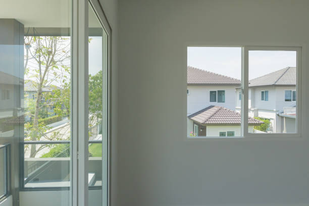istock Empty room with glass window frame house interior on concrete wall 1318372653