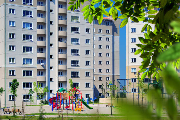 cityscape of residential apartment buildings - sunny apartment window sky imagens e fotografias de stock