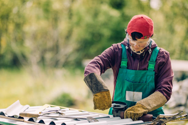 istock woman using angle grinder to cut sheet metal 1318374479