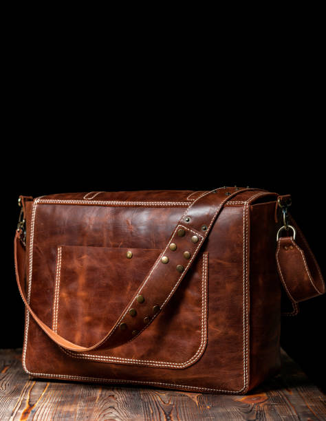 istock Back view of a retro style brown leather messenger bag 1318387400