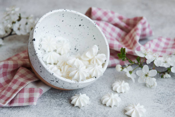 istock Small white meringues in the  ceramic bowl 1318392134