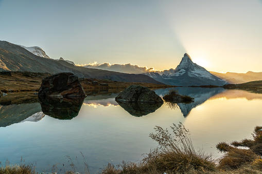 Panoramic evening view of Lake Stellisi with the Matterhorn Cervino Peak in the background. Impressive autumn scene of the Swiss Alps, Zermatt Resort, Switzerland, Europe