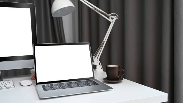 istock Mock up laptop computer with empty screen on white desk at modern workplace. 1318395067