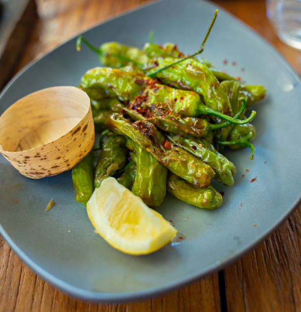 istock Grilled shishito peppers 1318397651