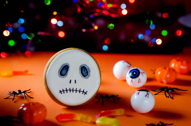 istock Halloween styled Gingerbread Cookies, candle and  spiders 1318397656