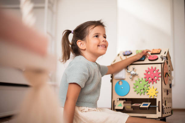 istock Toddler playing interactive games for good development at home. 1318397689