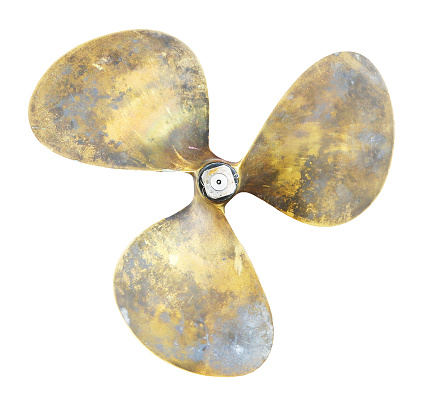Yellow brass metal propeller, isolated and cut out on white background. Large Boat Propeller on White Background stock photo